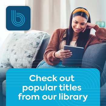 A woman sitting on a couch and smiling while reading from a tablet. A logo is in the top left, and a blue banner at the bottom says, “Check out popular titles from our library.”.