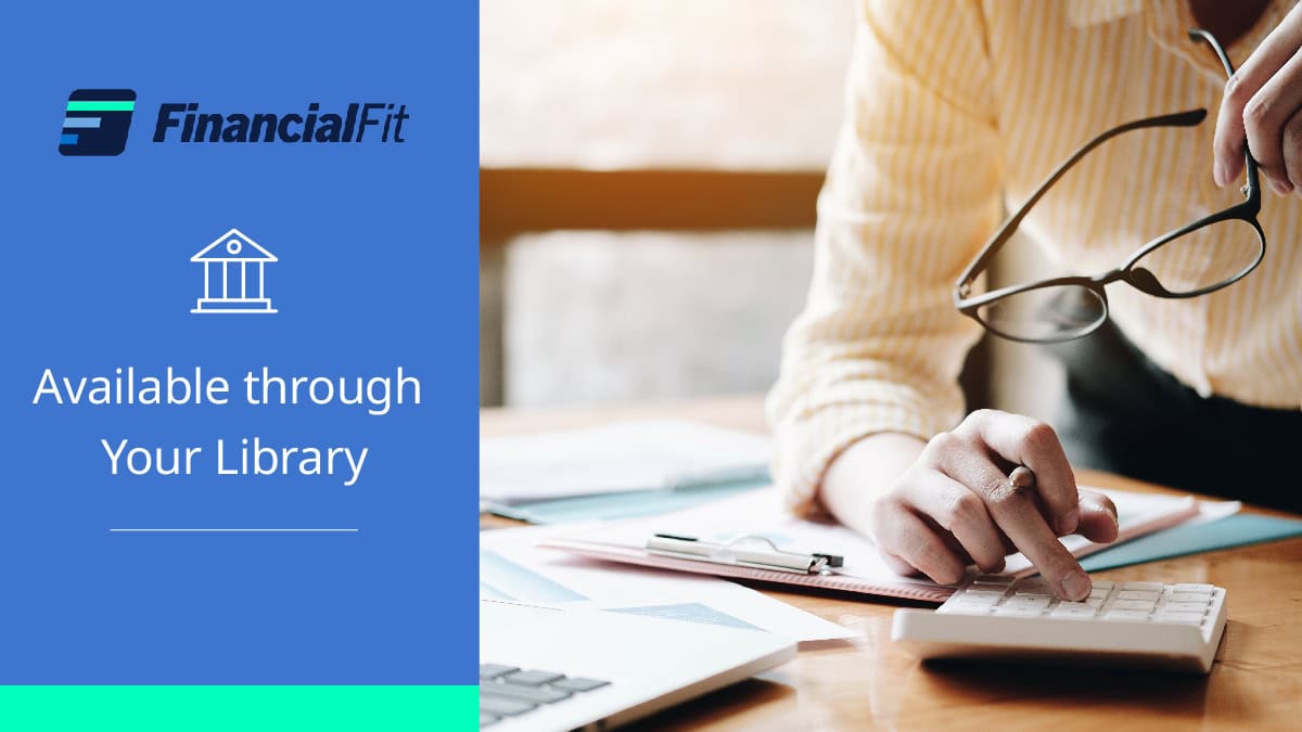 A person uses a calculator at a desk with documents. On the left, the FinancialFit logo appears above the text “Available through Your Library” with an icon of a building.